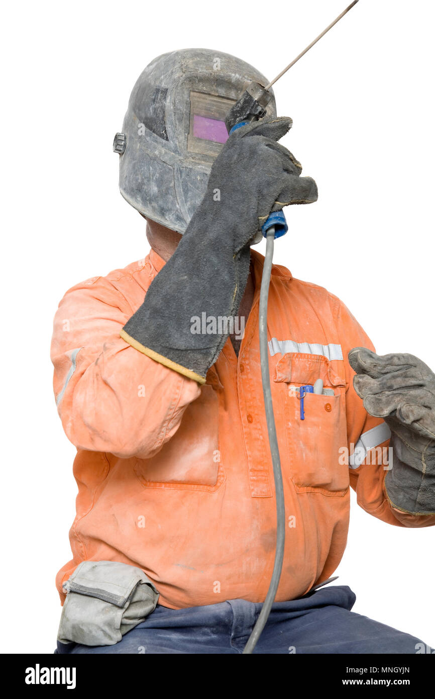 A manual worker using an arc welder. Stock Photo