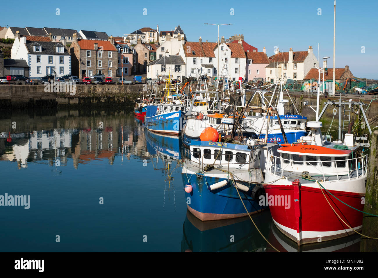 Fishing harbour with many fishing boats at Pittenweem in East Neuk of ...
