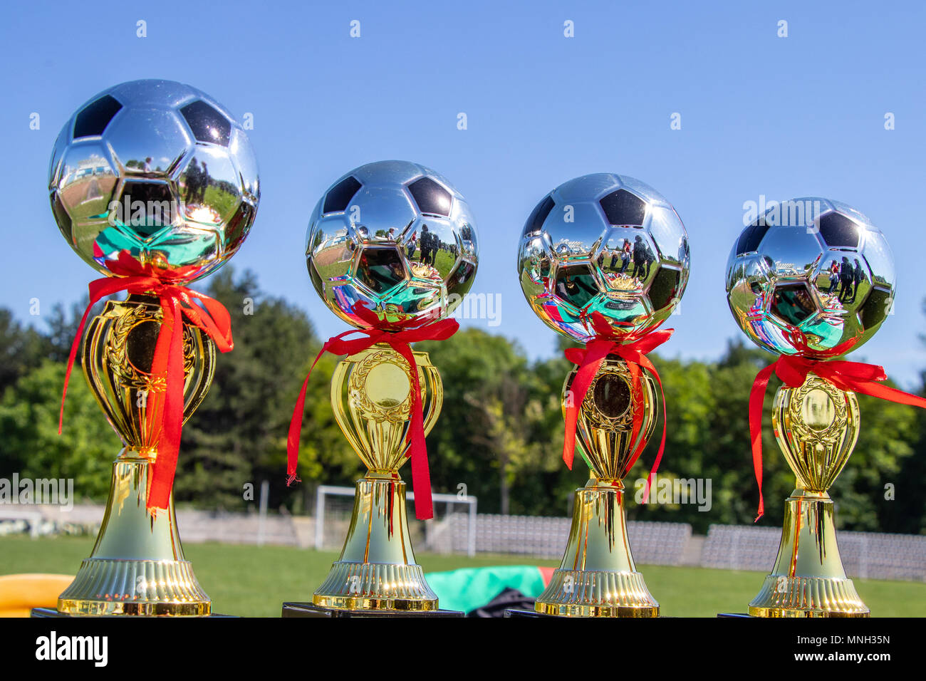 Award cups young footballers Stock Photo