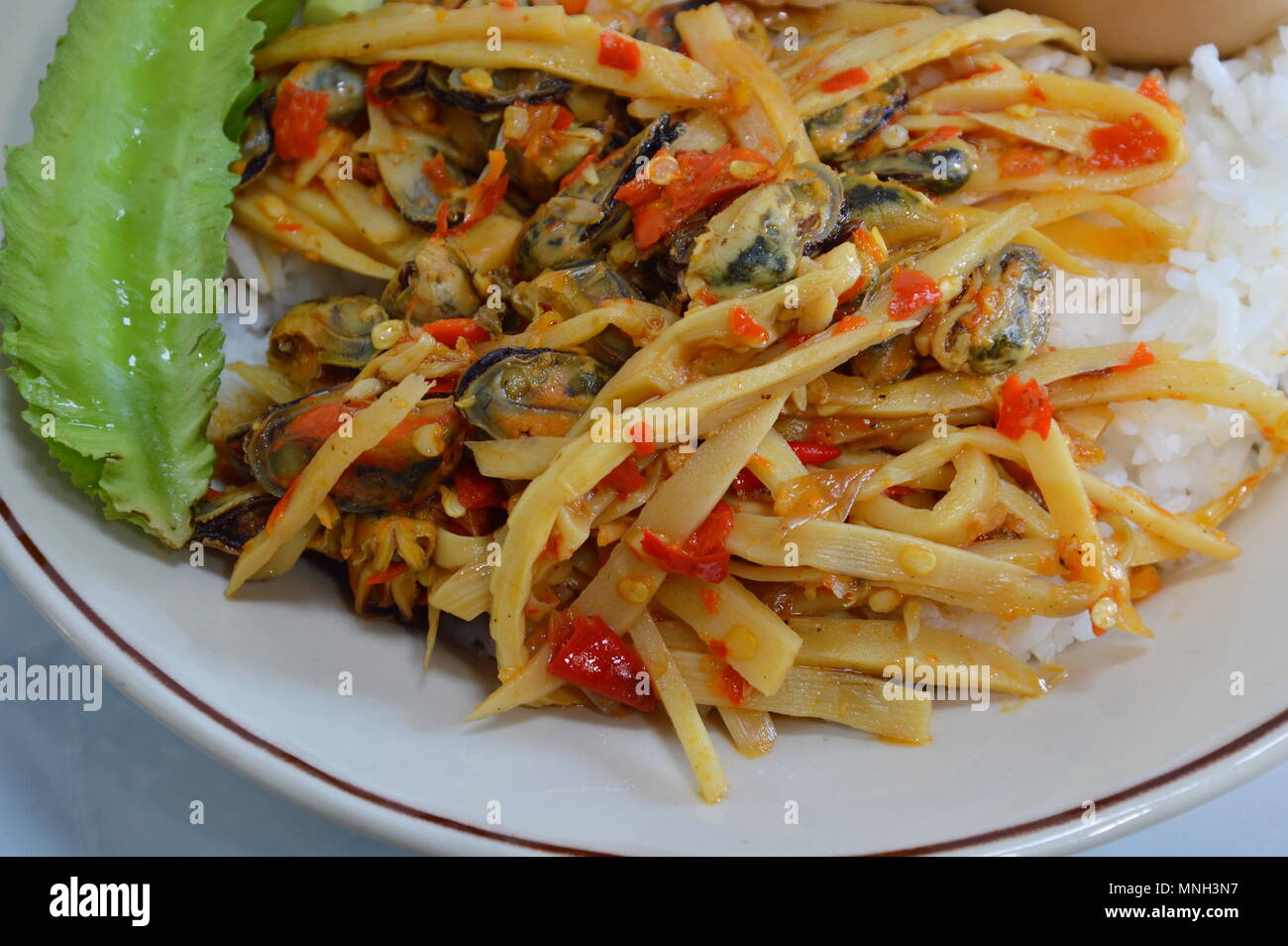 spicy stirfried bamboo shoot with mussel on rice Stock Photo Alamy