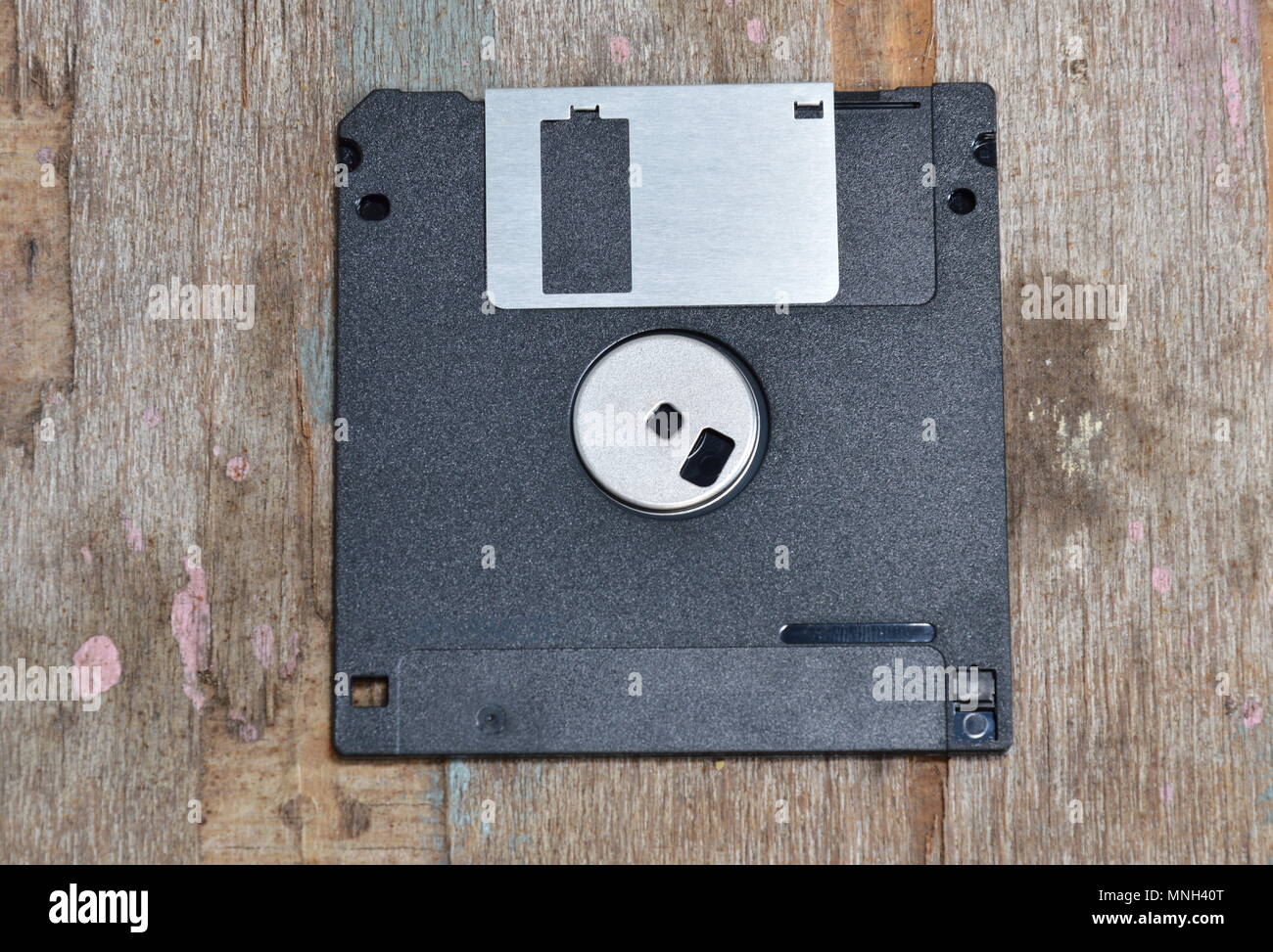 black floppy disk on wood board Stock Photo