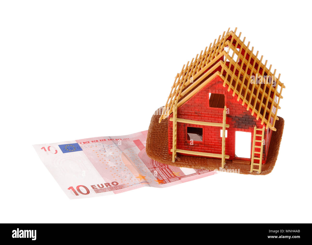 Stockholm, Sweden - November 27, 2017: A small red house being built on a 10 euro banknote isolated on white background. Stock Photo