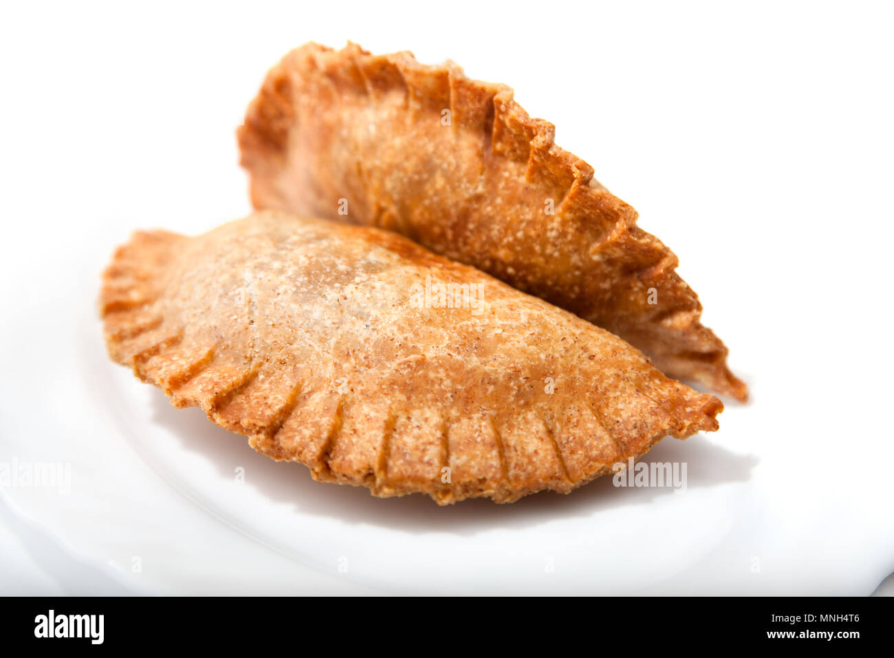 Crispy Vegetable samosa on plate- thin pastry wrapped around a veggie filling and fried. An Arab or Asian treat. Stock Photo