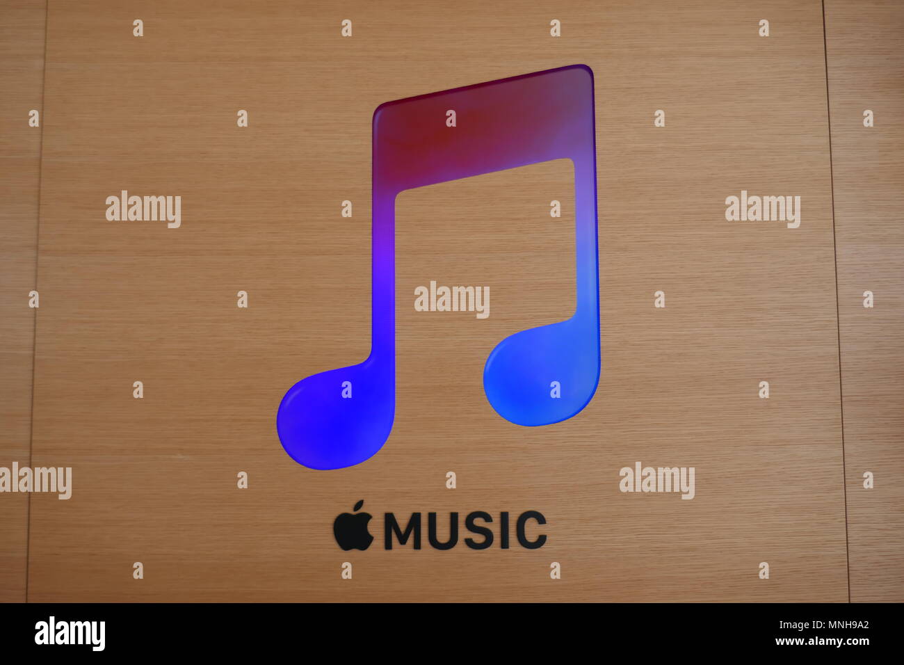 07 May 2018, USA, Cupertino: The logo of music streaming service Apple Music, pictured in the Apple Store at the new company headquarters Apple Park.  - NO WIRE SERVICE - Photo: Christoph Dernbach/dpa Stock Photo