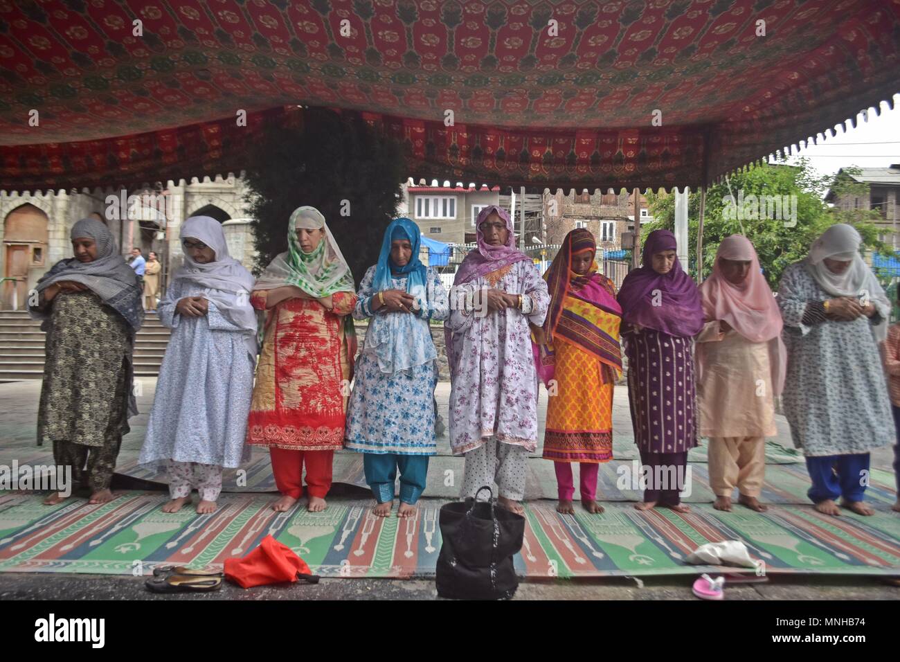 May 17, 2018 - Srinagar, J&K, India - Kashmiri Muslim women offer prayers during the first day of the Muslim holy month of Ramadan in Srinagar, Indian administered Kashmir. Muslims throughout the world are marking the month of Ramadan, the holiest month in the Islamic calendar during which devotees fast from dawn till dusk. Credit: Saqib Majeed/SOPA Images/ZUMA Wire/Alamy Live News Stock Photo