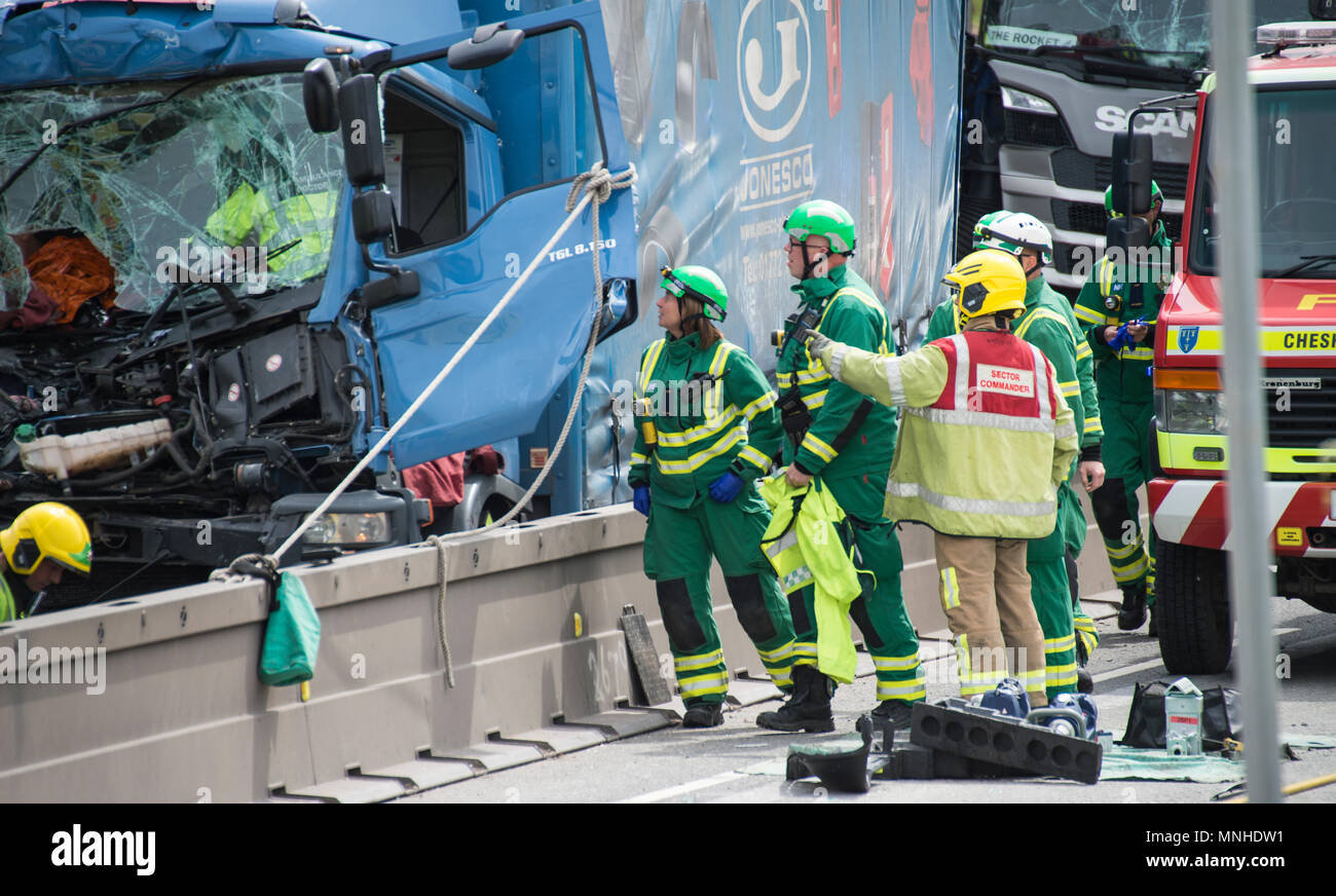 M6, between Holmes Chapel and Knutsford, Cheshire, UK. 17th May, 2018. Four HGVs crash one man trapped fire service and ambulance crews trying to extracate him air ambulance Credit: Chris Billington/Alamy Live News Stock Photo