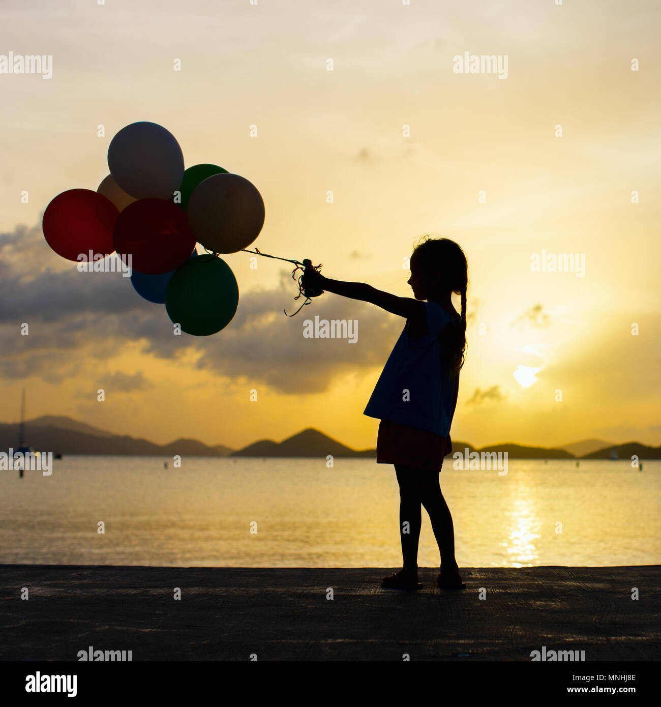 Girl silhouette balloons on white hires stock photography and images
