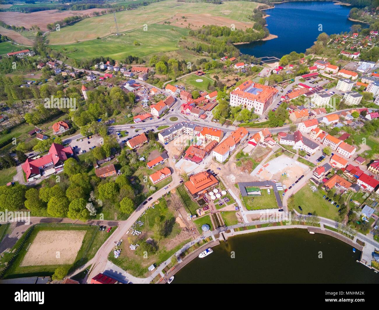 Aerial view of Ryn town, Poland (former Rhein, East Prussia). Medieval teutonic knights castle on the right Stock Photo