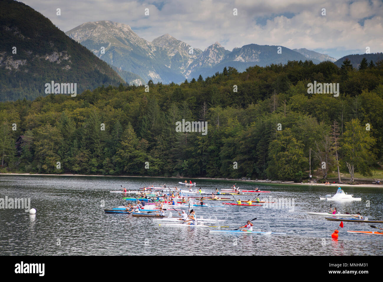 Start of canoe race at Lake Bohinj, largest permanent lake located in Bohinj Valley of Julian Alps, Triglav National Park, Slovenia Stock Photo