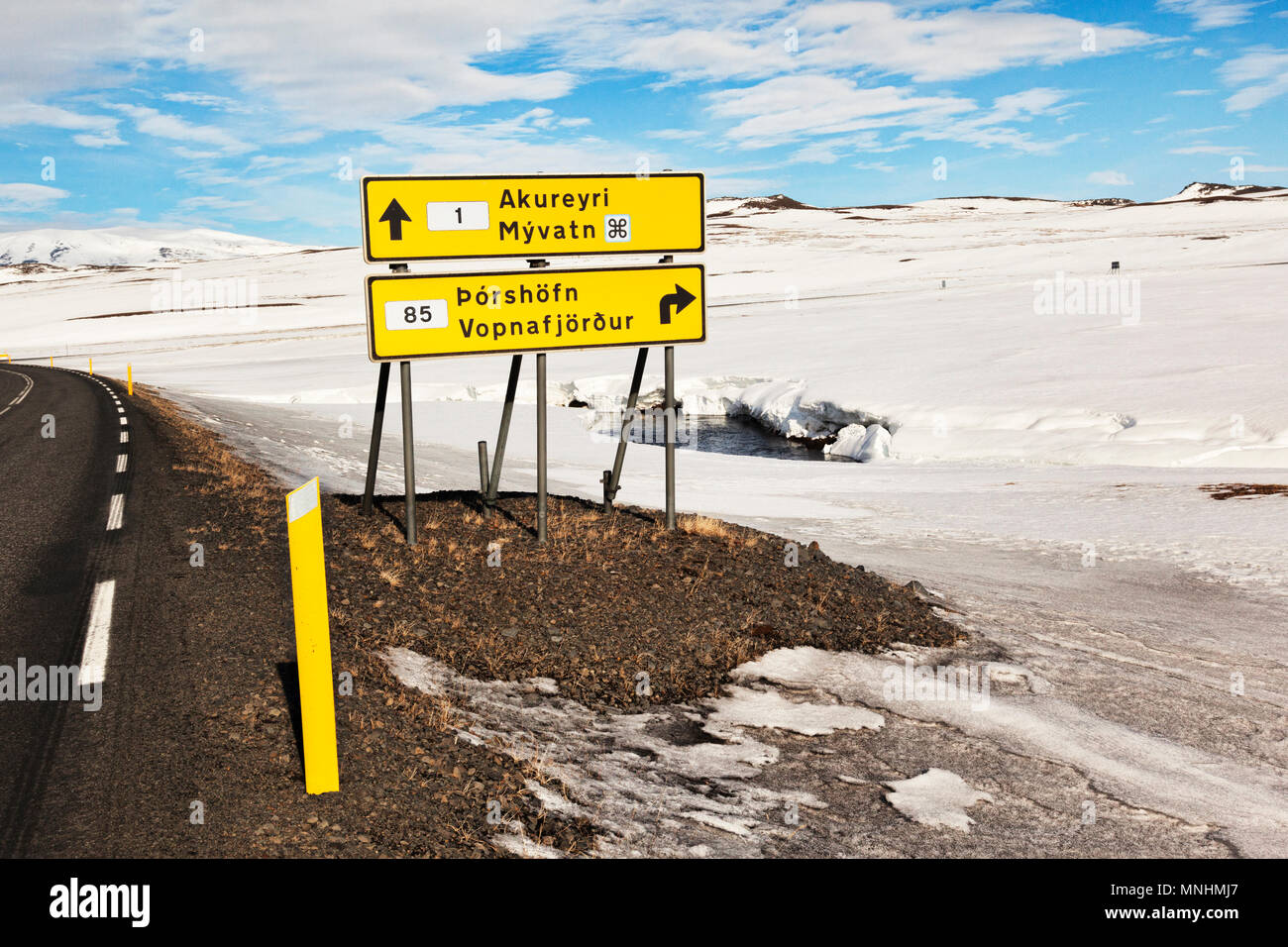 Road sign for Akureyri, Myvatn,Thorshofn and Vopnafjordur, beside the Iceland Ring Road. Stock Photo