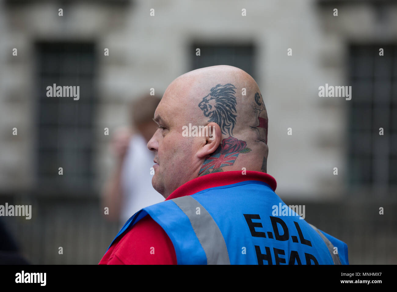 An EDL head steward overseas the march in central London Stock Photo