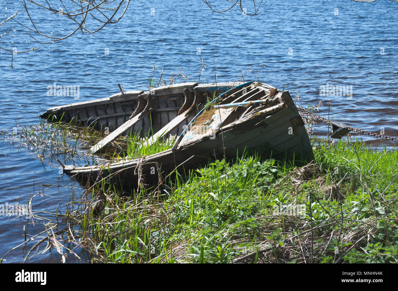 Old rowing boat half sunk Stock Photo Alamy