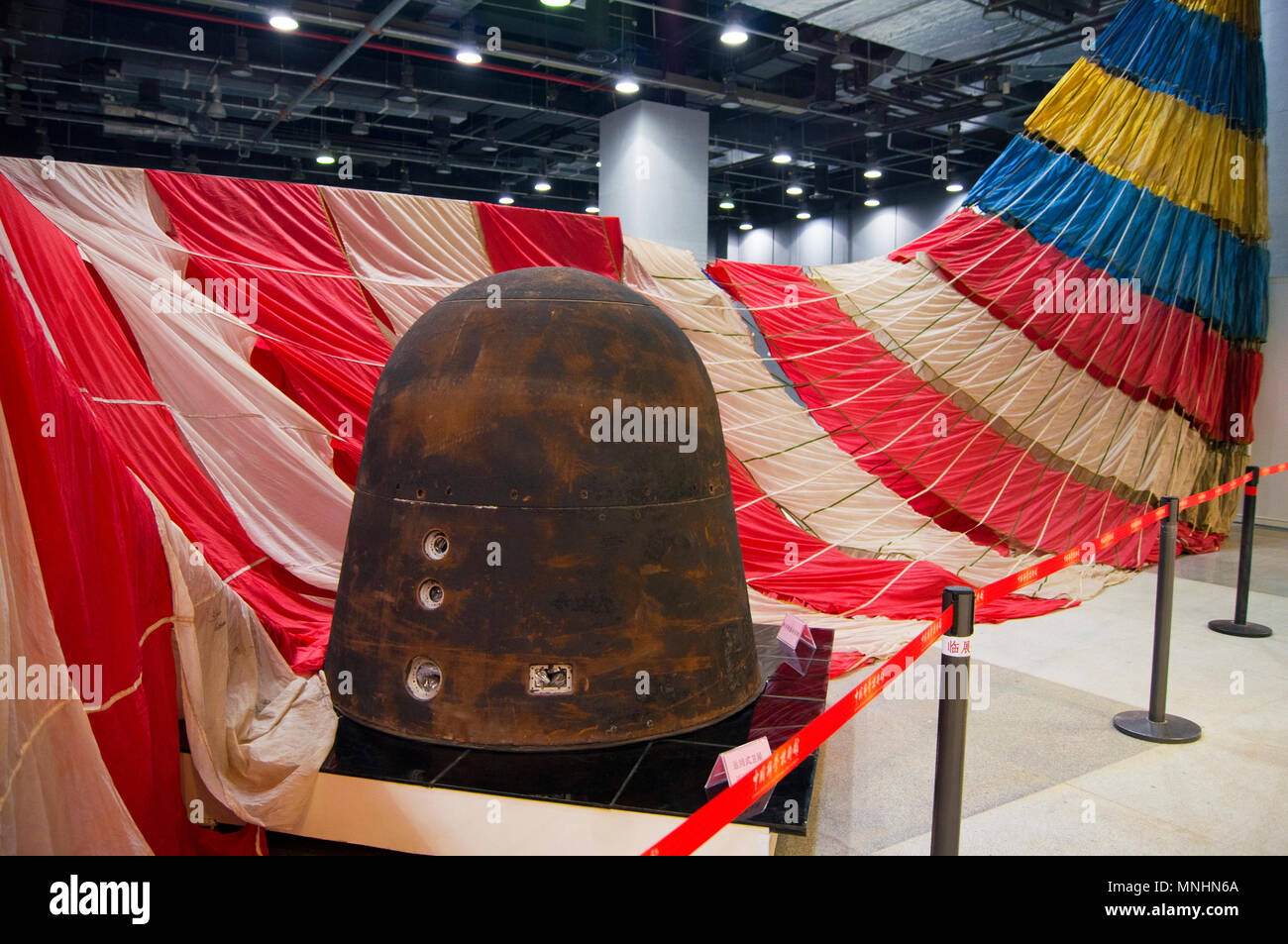 A Chinese recoverable capsule and parachute on display at the China Science and Technology Museum in Beijing, China. Stock Photo