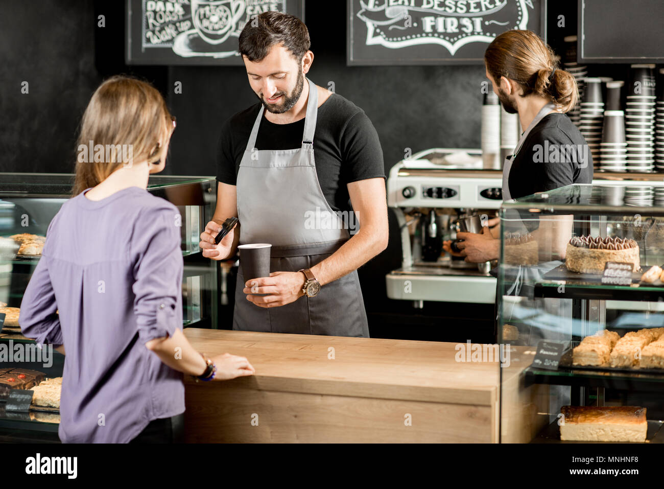 Caucasian handsome bearded man barista making cold iced coffee cappuccino  latte in shaker. Waiter server pouring drink in plastic transparent cup.  Sma Stock Photo - Alamy