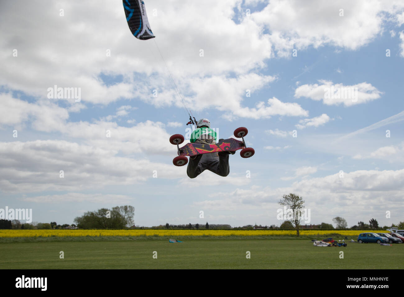 Extreme sport kite landboarding in Essex, UK. Going airborne. Stock Photo