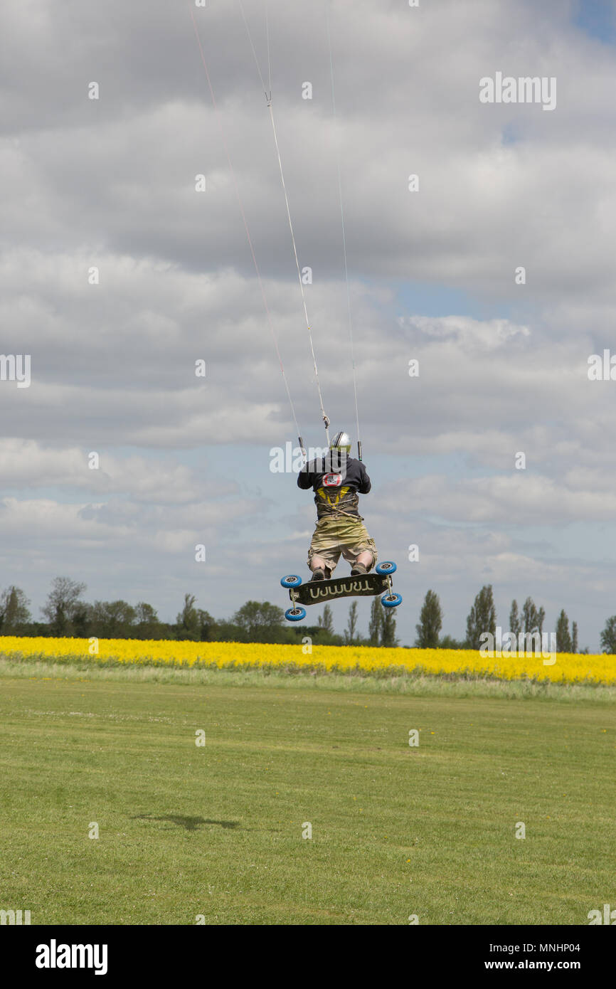 Extreme sport kite landboarding in Essex, UK. Airborne. Stock Photo