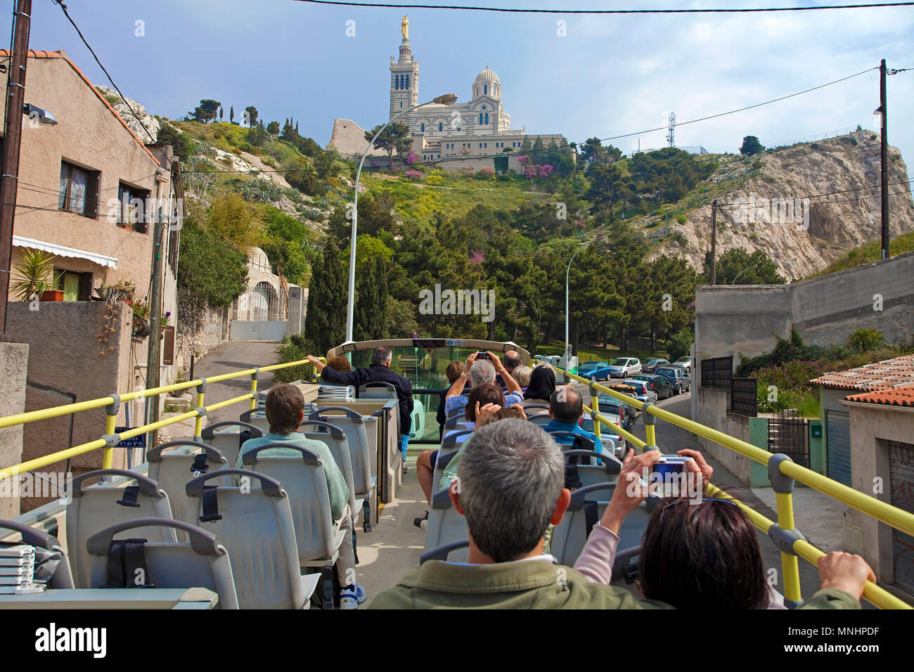 City tour, tourist bus on the way to Cathedral of Notre-Dame de la Garde, Marseille, Bouches-du-Rhone, South France, France, Europe Stock Photo
