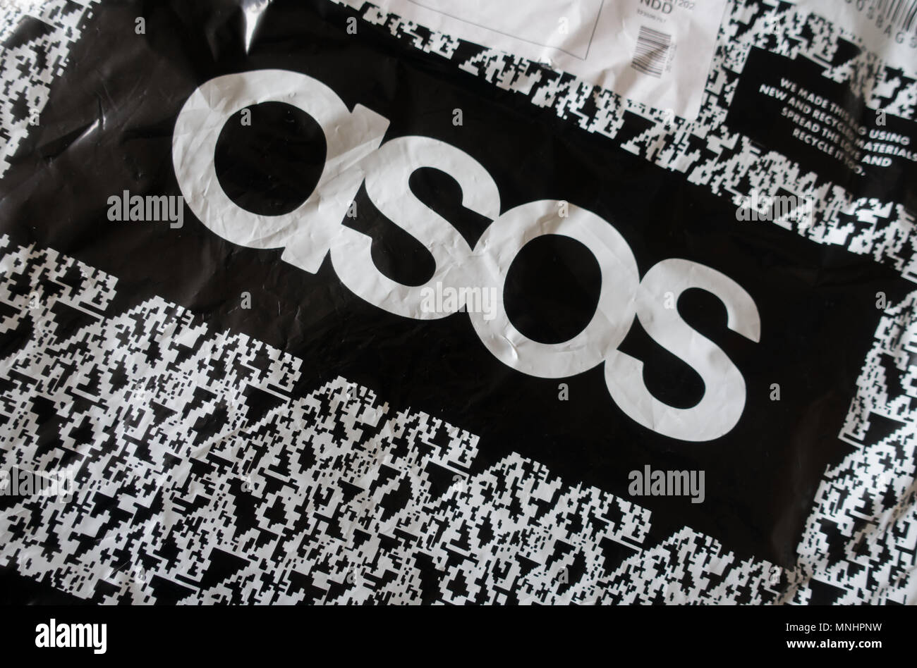 Asos plastic packaging from the online shopping giant Stock Photo - Alamy