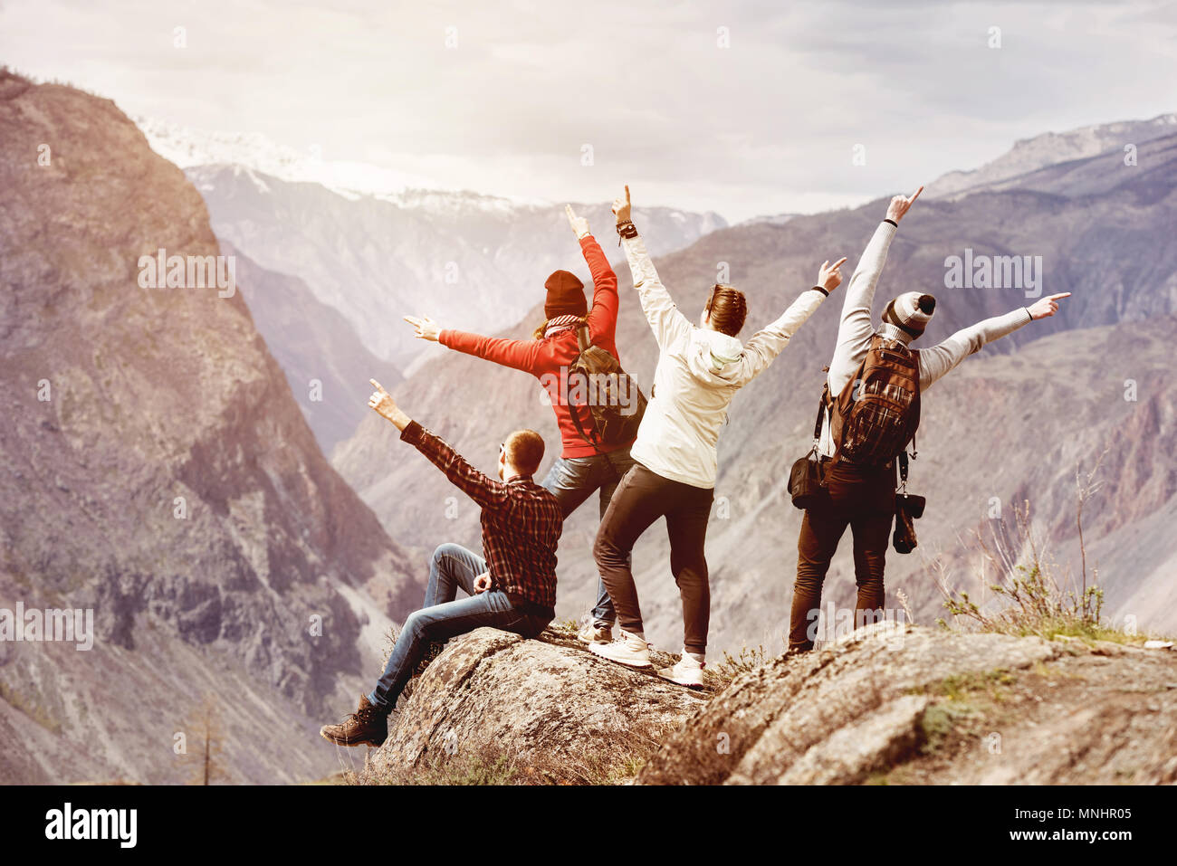 Happy tourists having fun mountain top Stock Photo