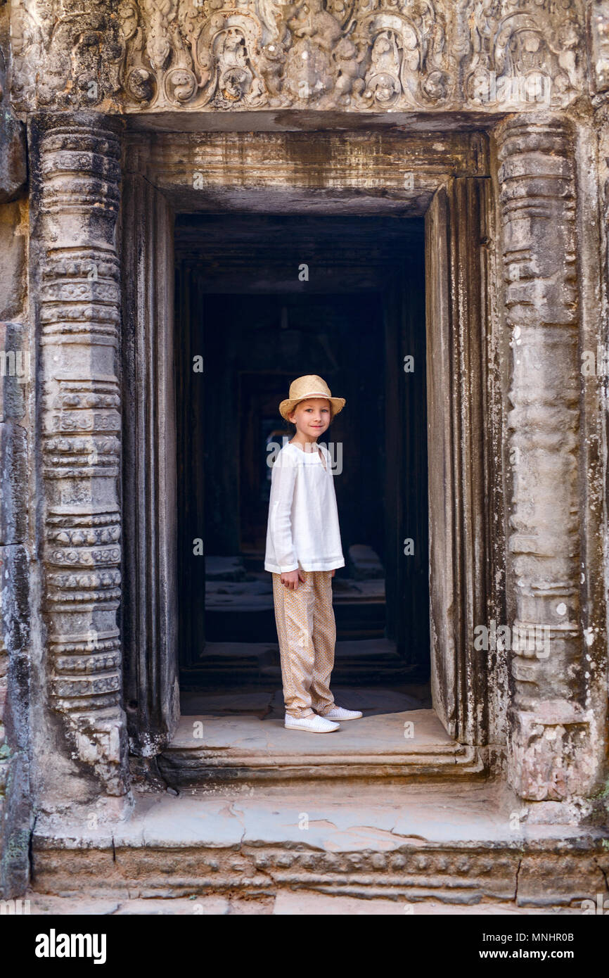 Little girl in ancient temple in Siem Reap,  Cambodia Stock Photo