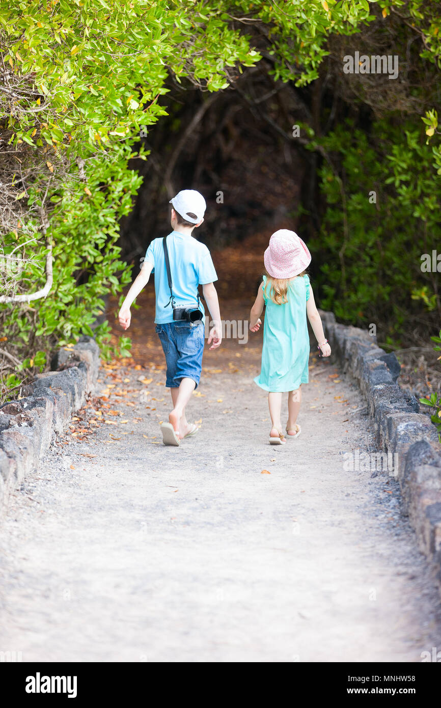 Brother and sister outdoors in a beautiful park Stock Photo - Alamy