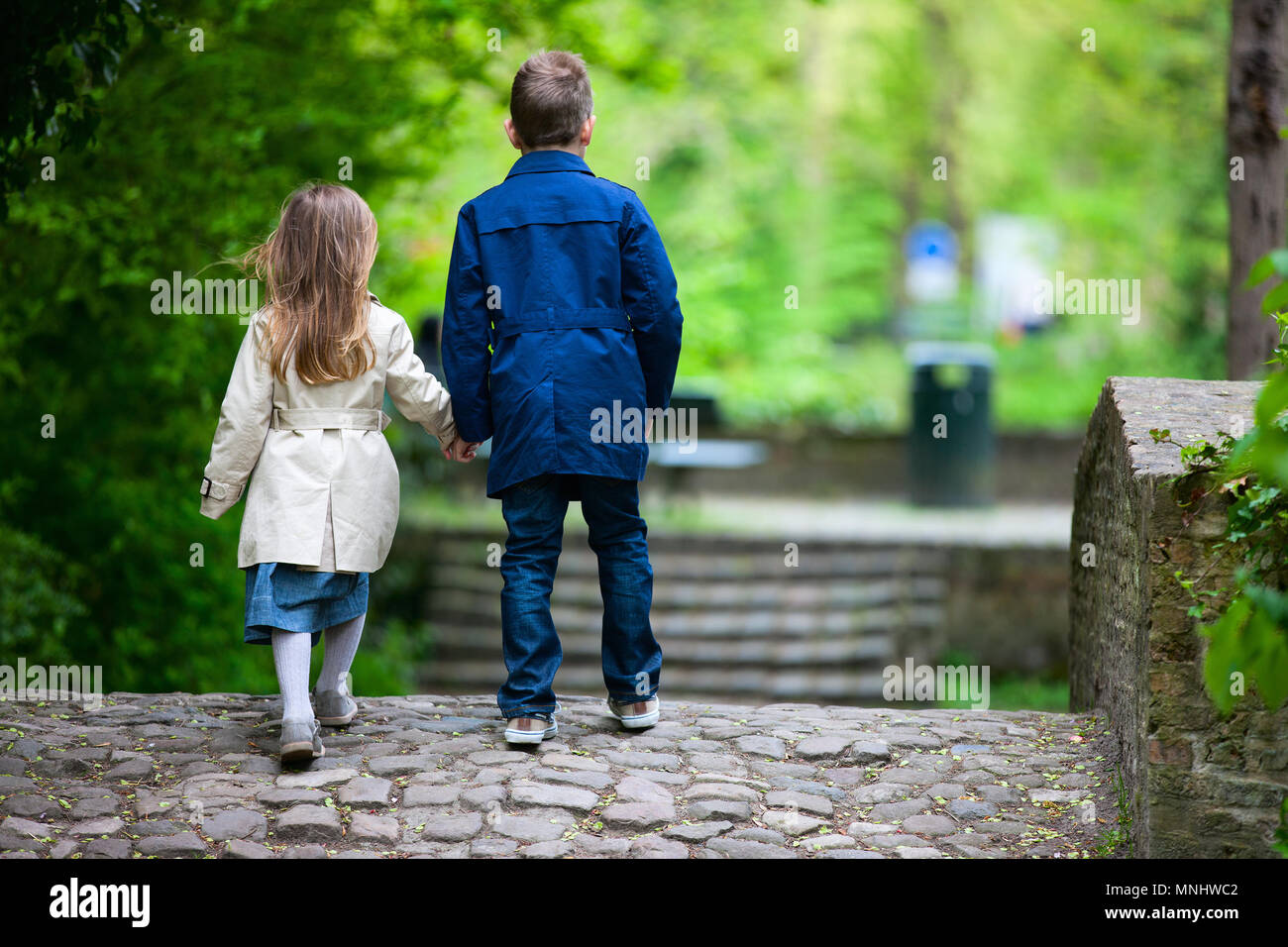 Brother and sister outdoors in a beautiful park at spring day Stock ...