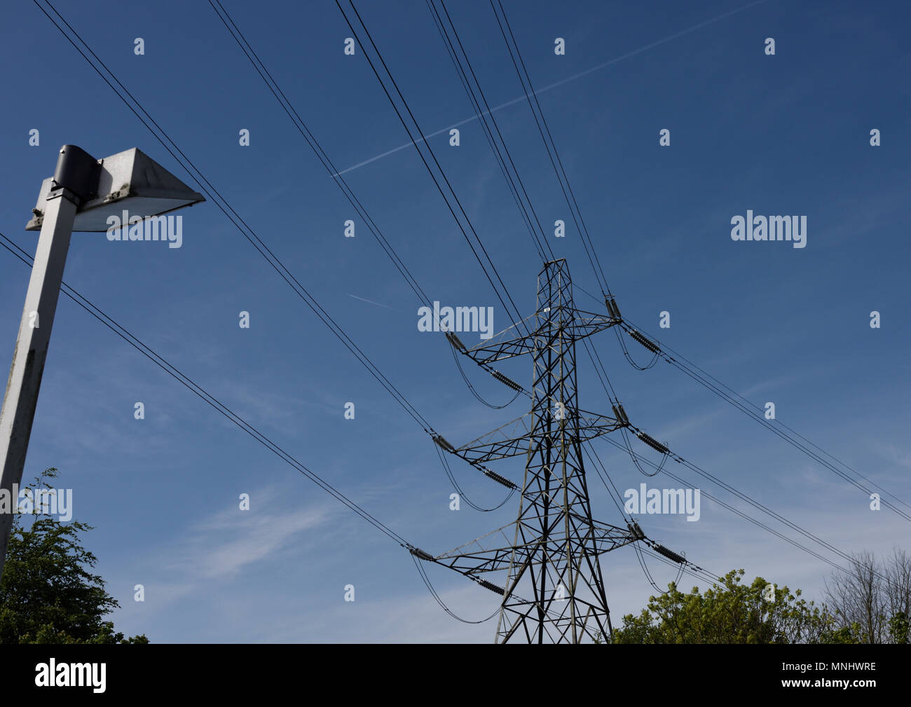 Electricity pylon and overhead high voltage power lines part of the the