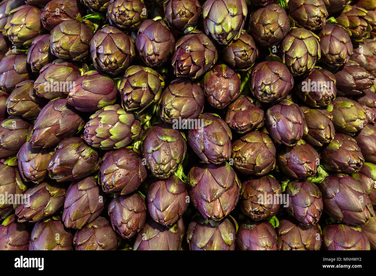 Fresh artichokes at italian local market close up Stock Photo