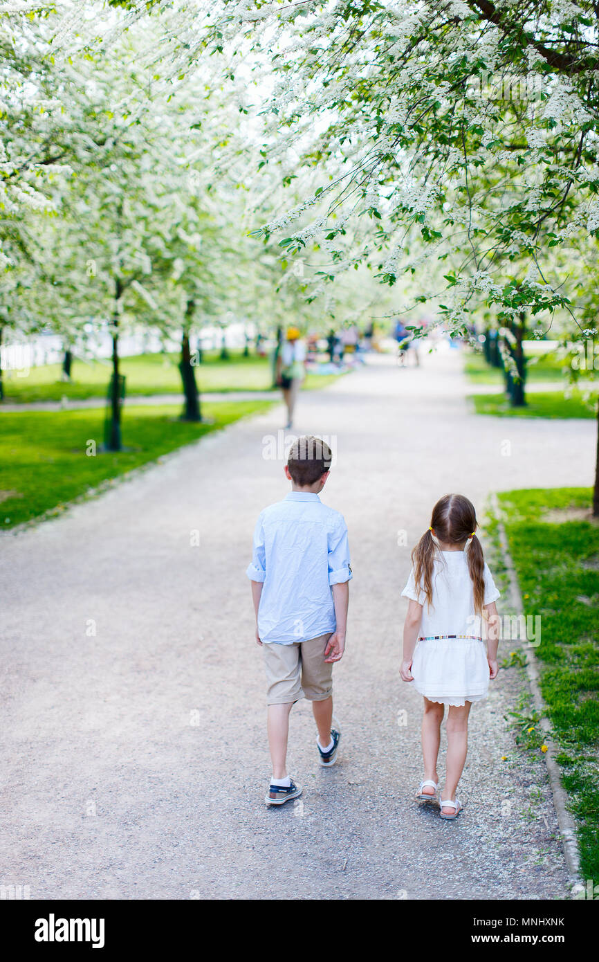 Brother and sister outdoors in a beautiful park on spring day Stock ...