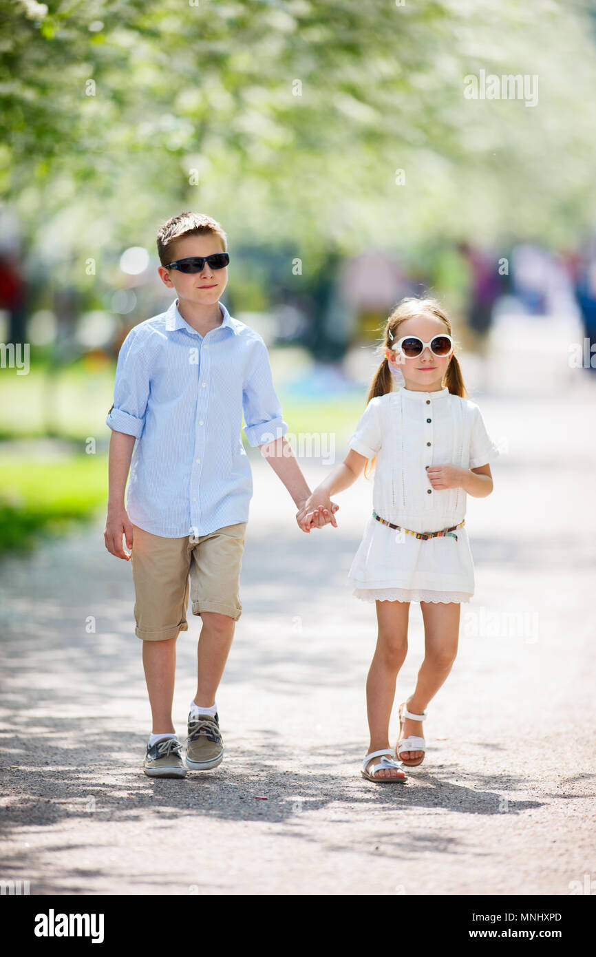 Brother and sister outdoors in a beautiful park at spring day Stock ...