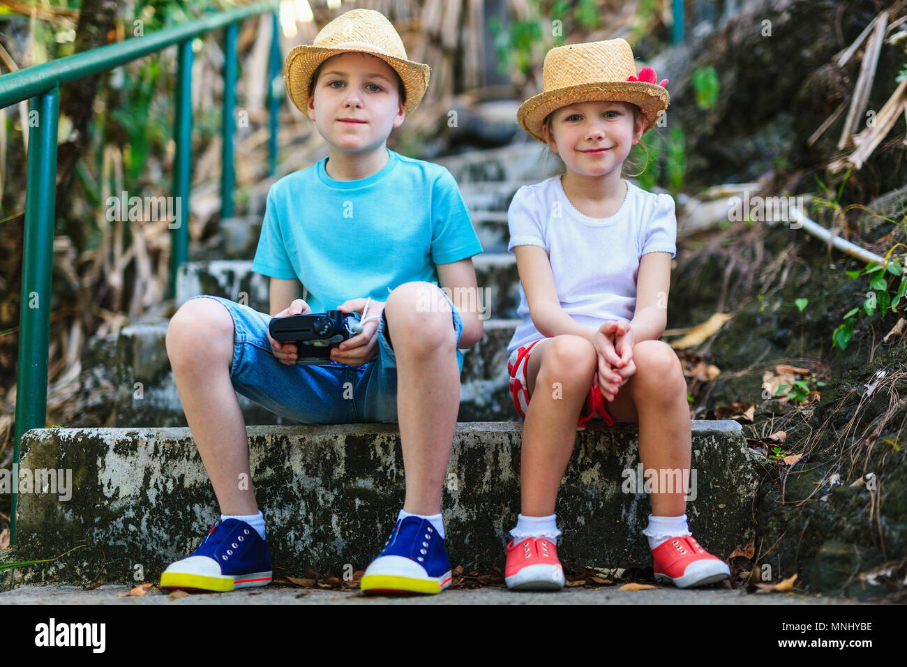 Brother and sister playing in the forest hi-res stock photography and ...