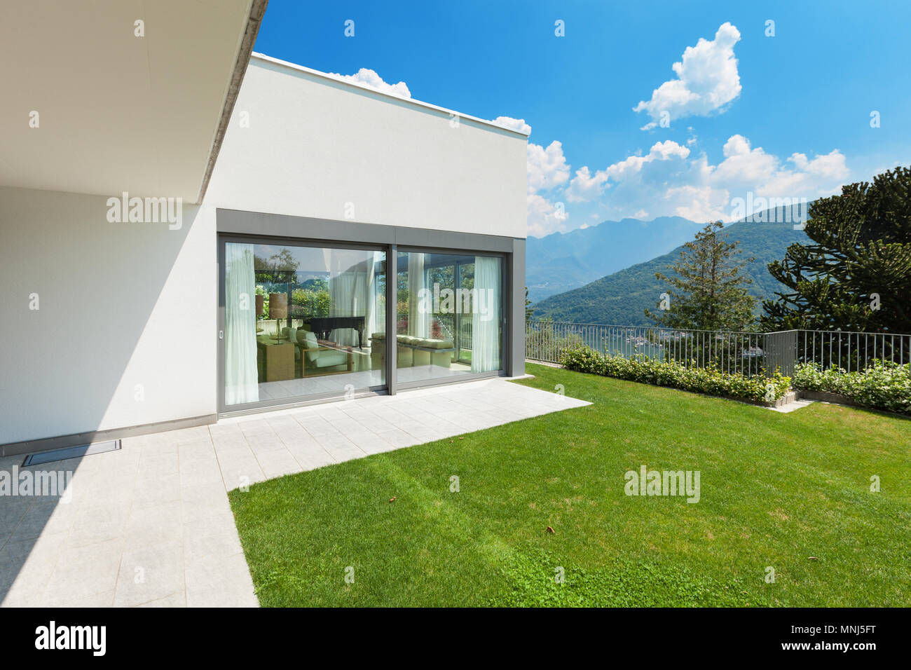 Architecture, modern white house with garden, outdoors Stock Photo