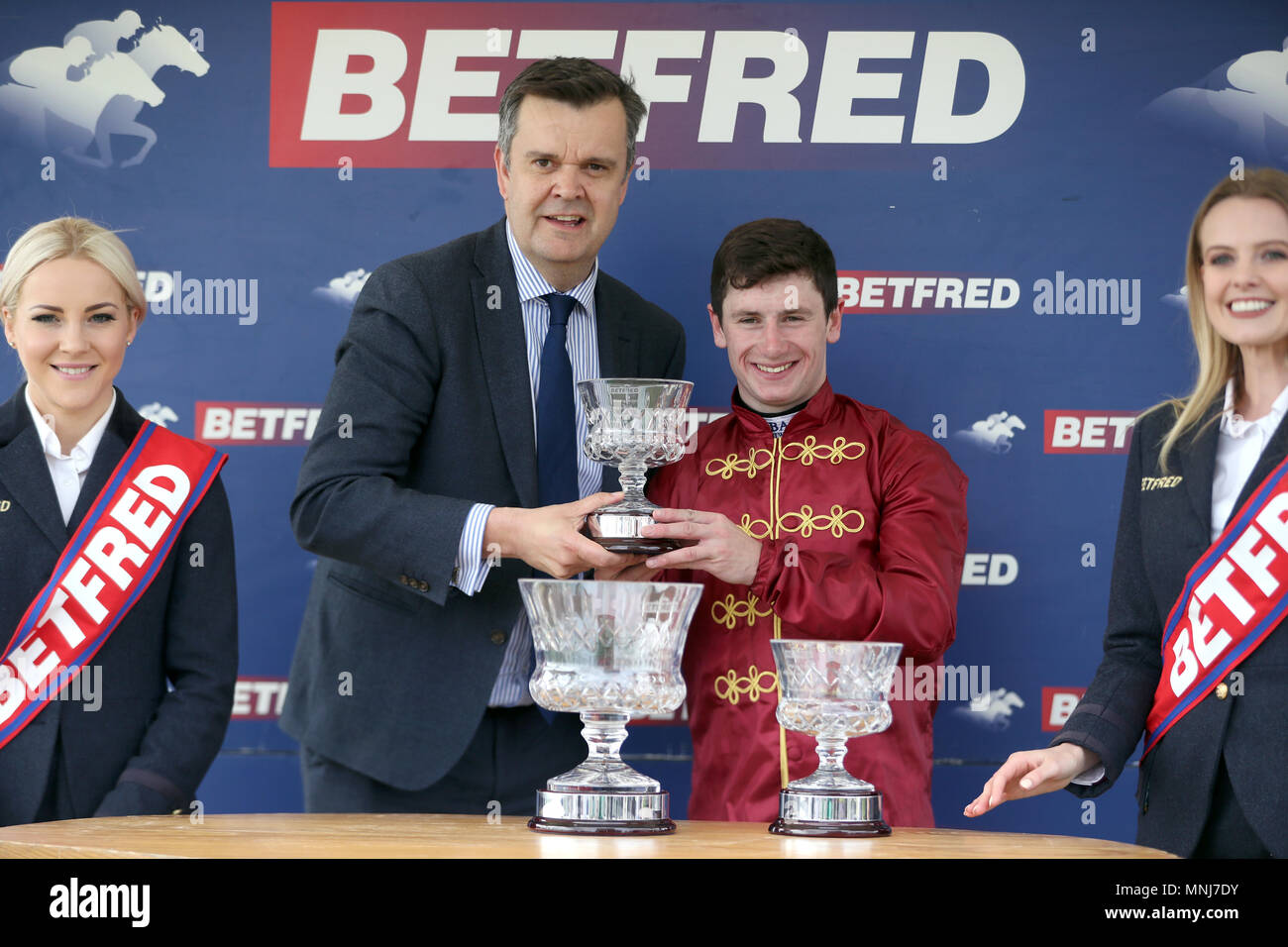 Oisin Murphy (right) poses with the trophy after winning the Betfred Dante Stakes onboard Roaring Lion during day two of the 2018 Dante Festival at York Racecourse. Stock Photo