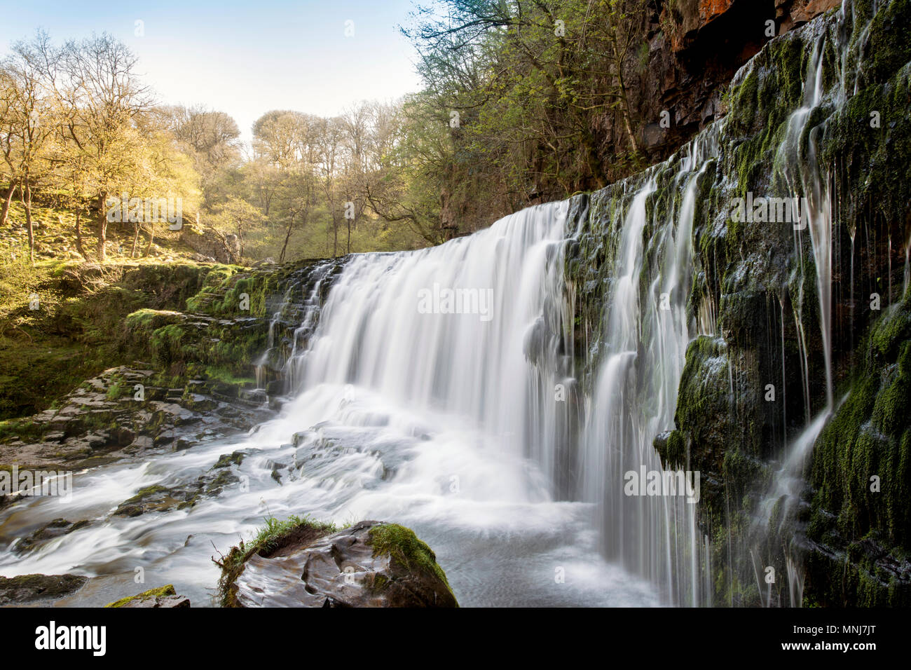 The Sgwd Isaf Clun-Gwyn (Lower Fall of the white Meadow) waterfall on the River Mellte near Ystradfellte in Powys, Wales Stock Photo