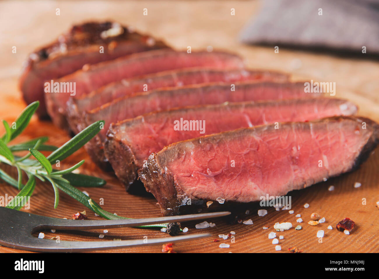 cooked beef steak medium well sliced Stock Photo Alamy