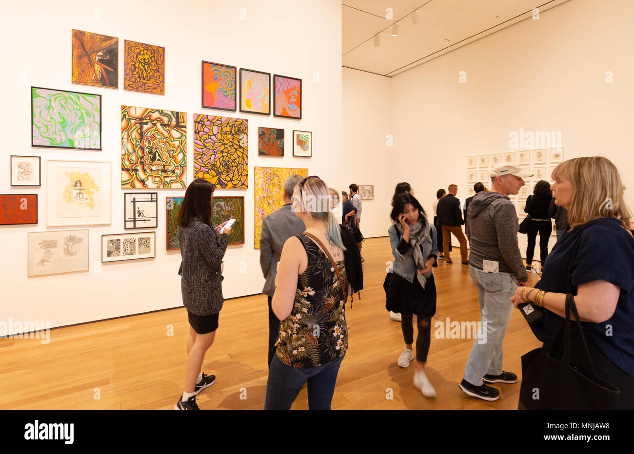 Visitors looking at Modern Art paintings, MoMA ( Museum of Modern Art ), New York city, USA Stock Photo