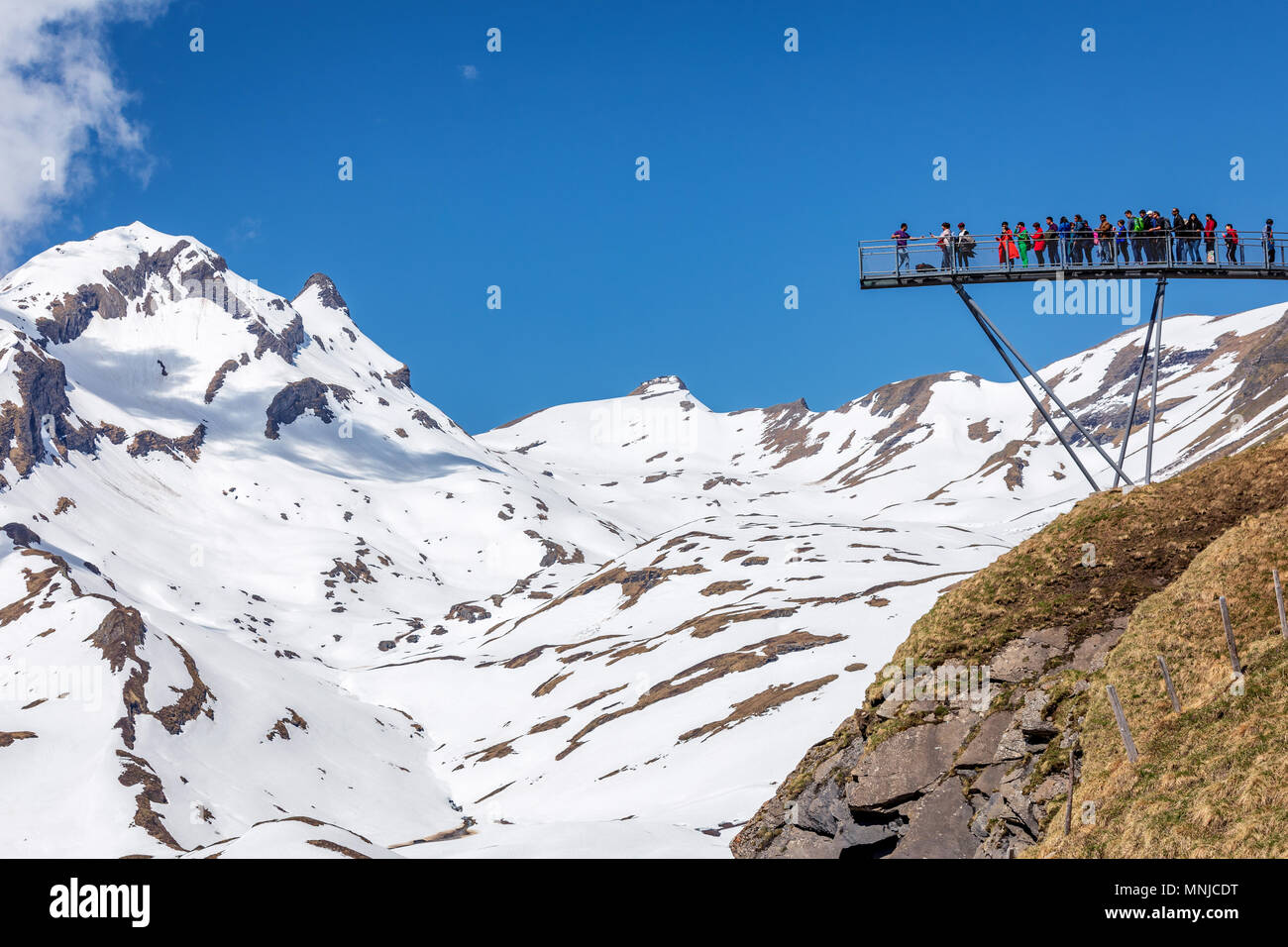 People on the observation platform at the top of First mountain above Grindelwald, Bernese Oberland, Switzerland Stock Photo