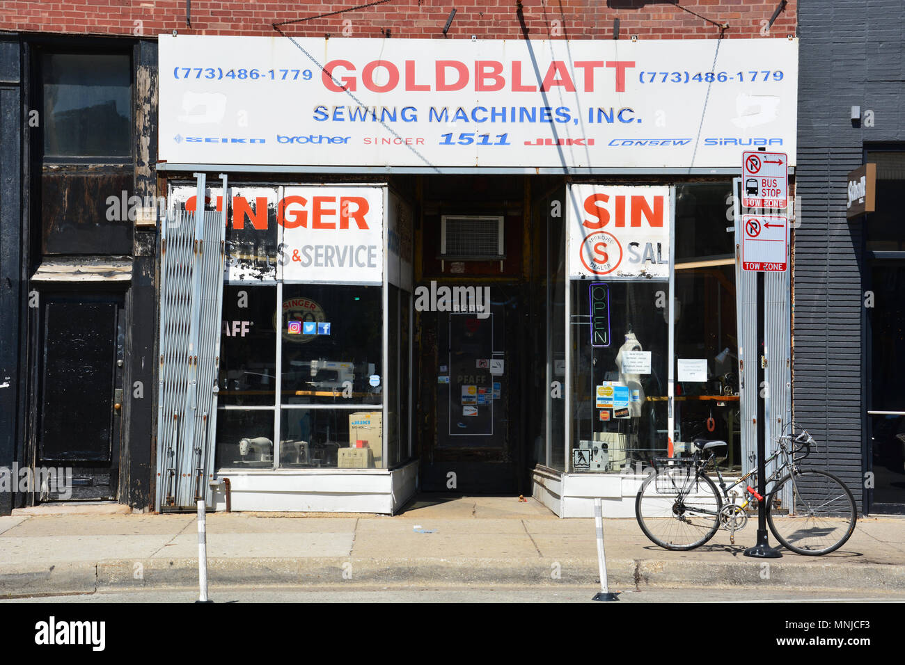 A sewing machine sales and repair shop is a remnant of the past on Milwaukee Avenue in the trendy Wicker Park neighborhood of Chicago. Stock Photo