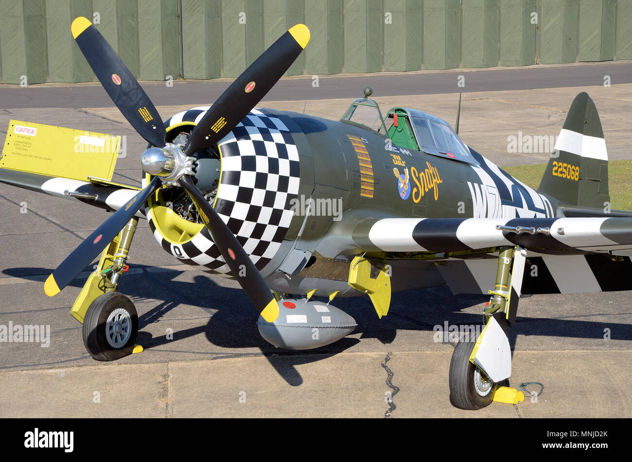 Republic P-47 Thunderbolt named Snafu, War Eagle. World War Two, Second World War fighter plane rolled out after painting. Checkerboard nose Stock Photo