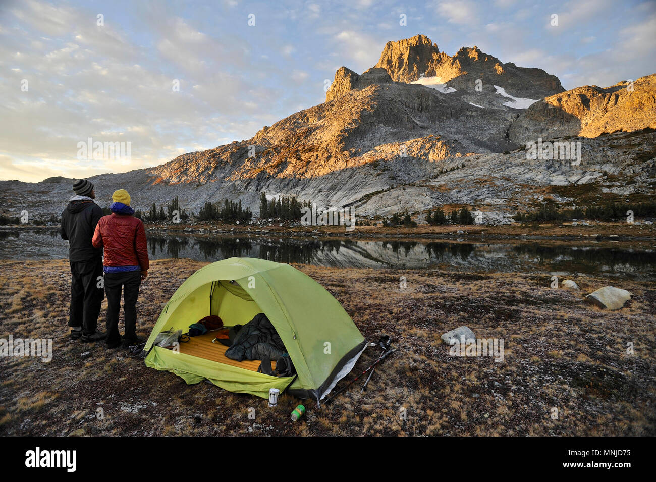 Backpackers camp near Thousand Island Lake with Banner Peak in background on trek of Sierra High Route in Minarets Wilderness, Inyo National Forest, California, USA Stock Photo