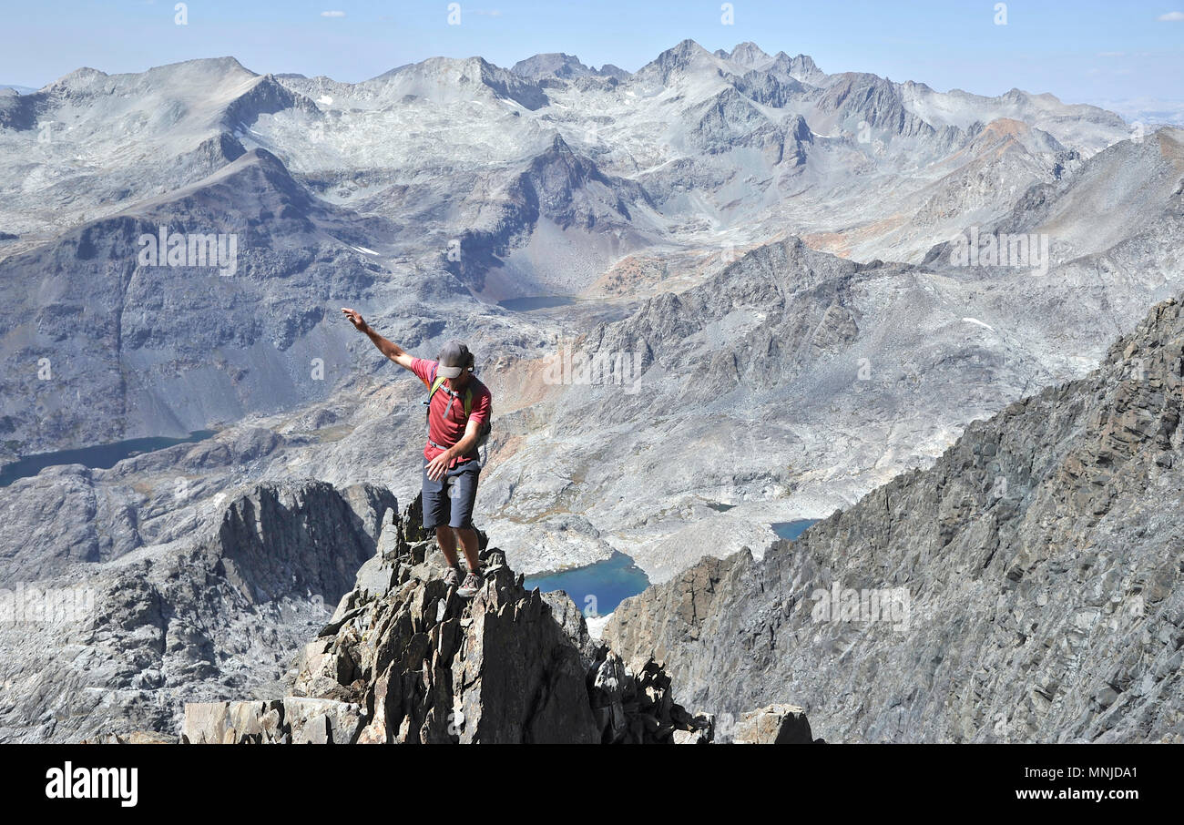 Backpackers climbing Mt Ritter on trek of Sierra High Route in Minarets Wilderness, Inyo National Forest, California, USA Stock Photo