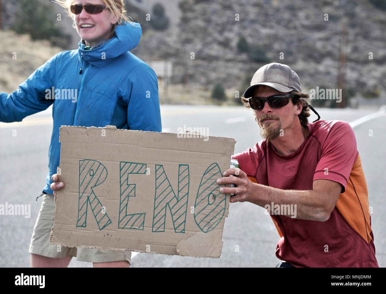 Backpackers hitchhike in Lee Vining after completing a two-week trek of the Sierra High Route Yosemite National Park, California. The 200-mile route roughly parallels the popular John Muir Trail through the Sierra Nevada Range of California from Kings Canyon National Park to Yosemite National Park. Stock Photo