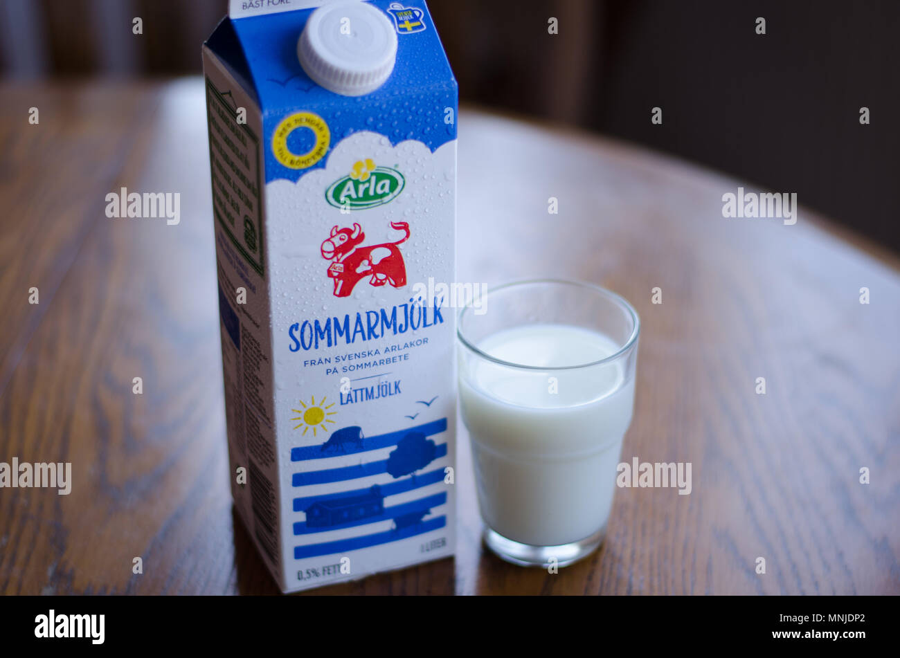 Stockholm, Sweden - 12 may 2018. A carton of milk and a glass of Arlas new milk "Sommarmjölk", made to give the farmers more money for their productio Stock Photo