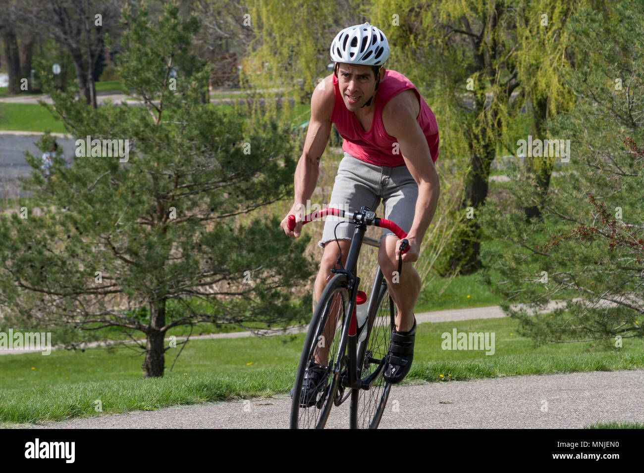 Front view of person Fixie-Gear Biking, Minneapolis, Minnesota, USA Stock Photo
