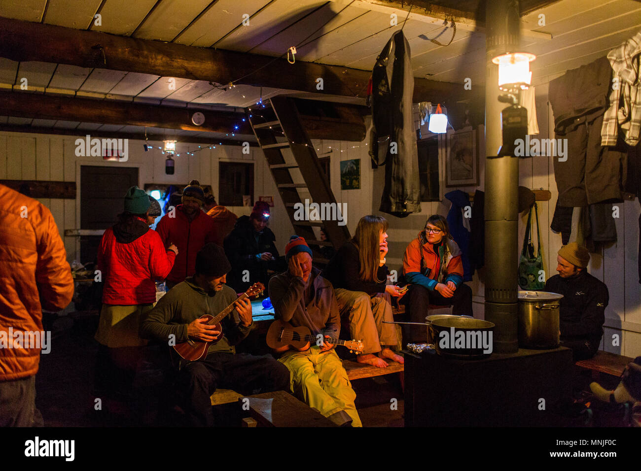 Group of people relaxing in backcountry hut near Mount Hood, Oregon, USA Stock Photo