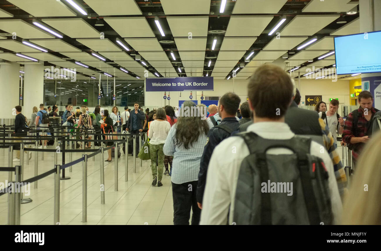 people arriving and entering UK through the border passport control