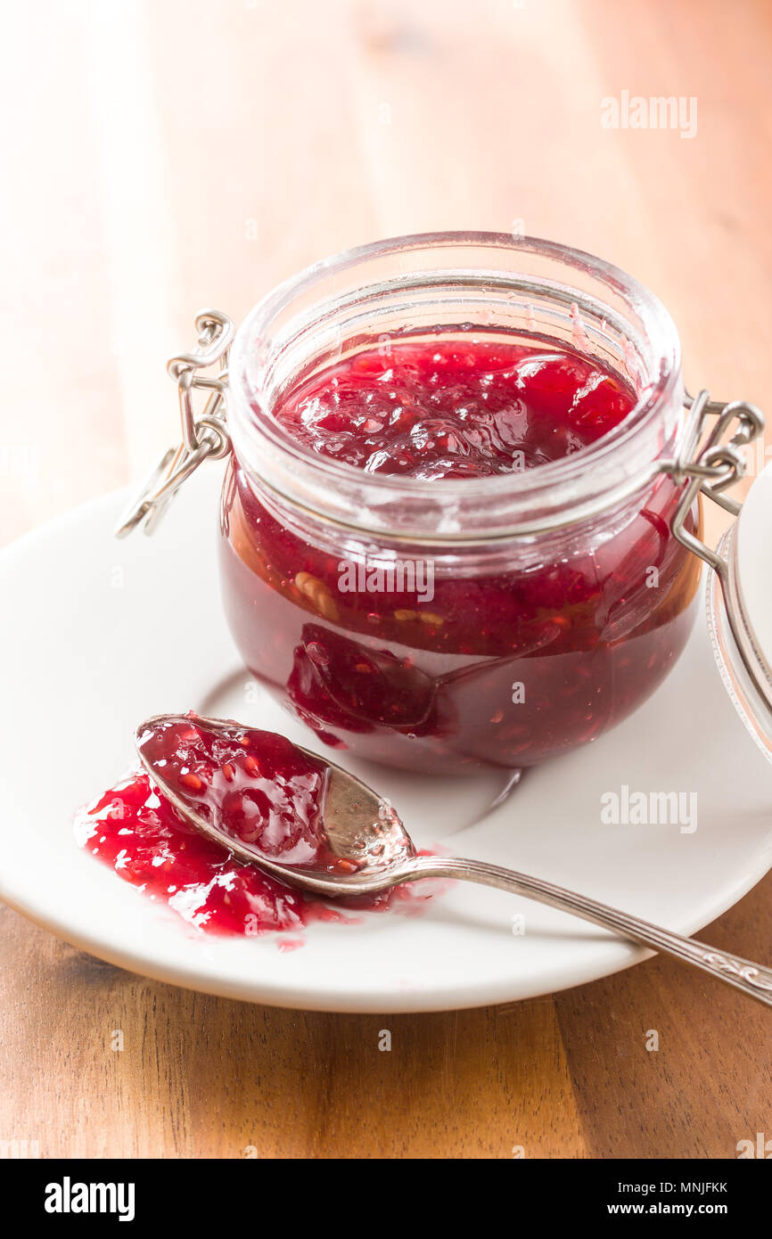 Raspberry jam jelly in jar. Stock Photo