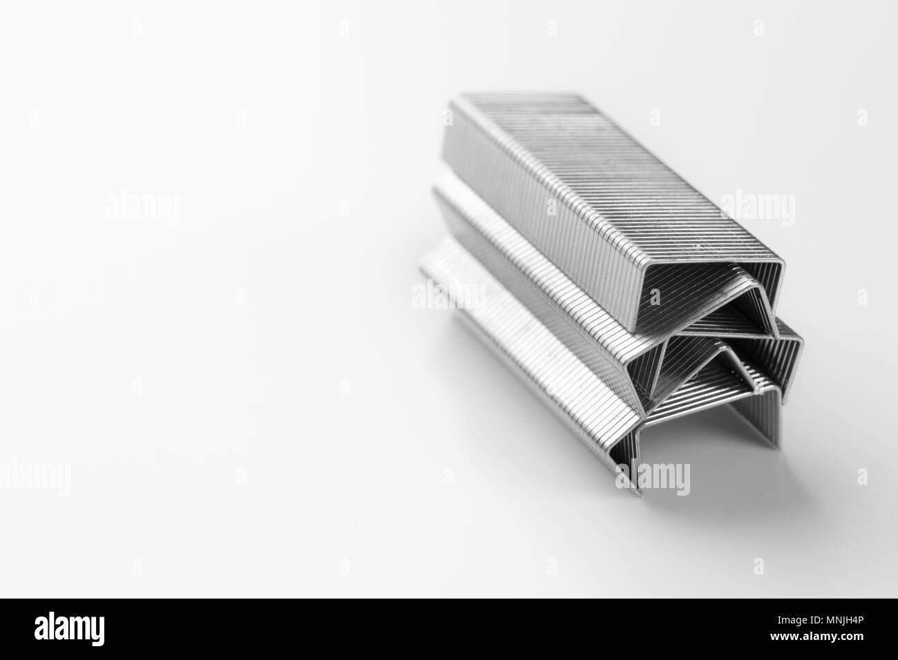 Metal staples stacked Stock Photo Alamy