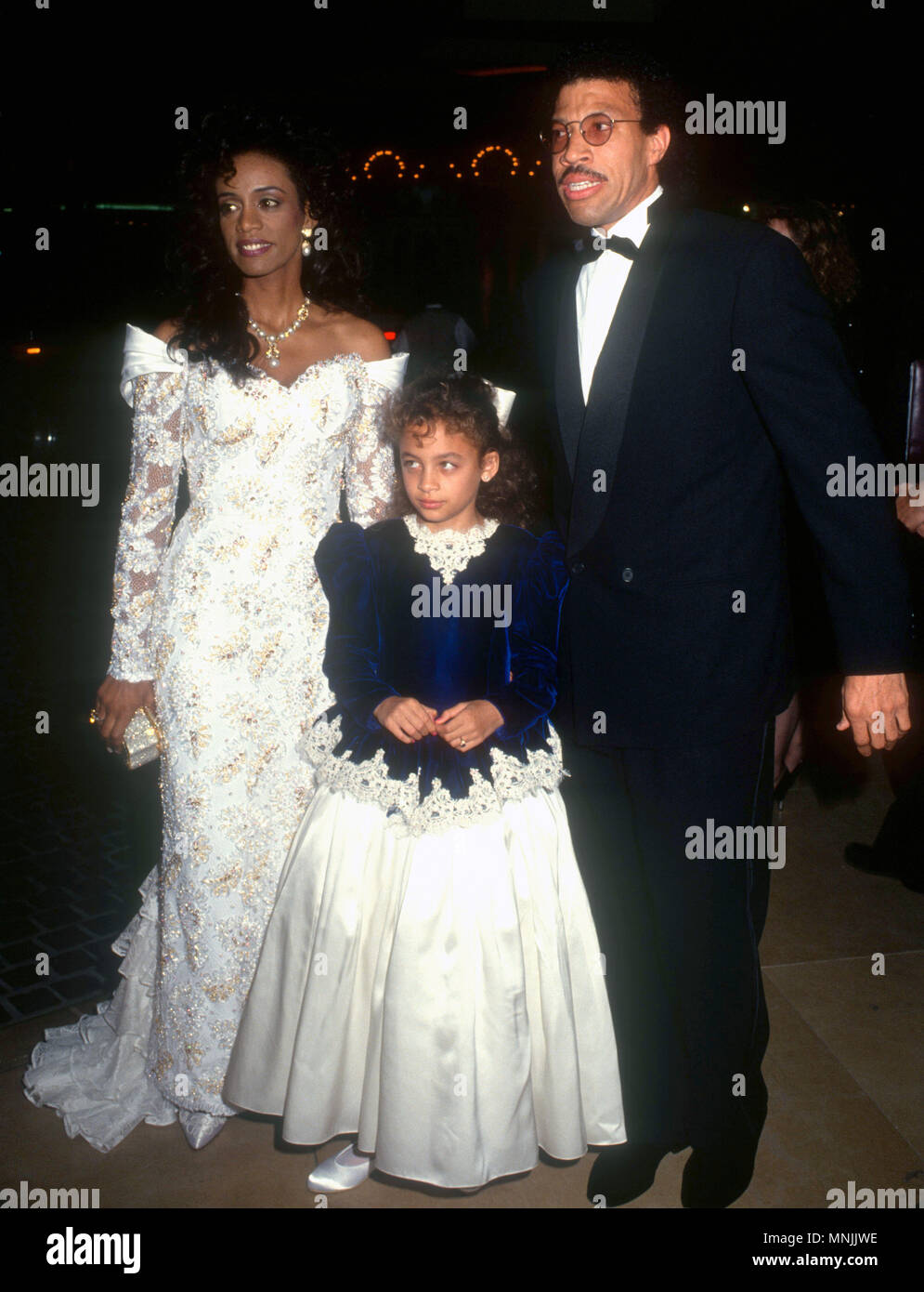 BEVERLY HILLS, CA - OCTOBER 26: (L-R) Brenda Harvey Richie, Nicole Richie  and father Singer Lionel Richie attend the 1990 Carousel Ball of Hope to  Benefit the Barbara Davis Center for Childhood
