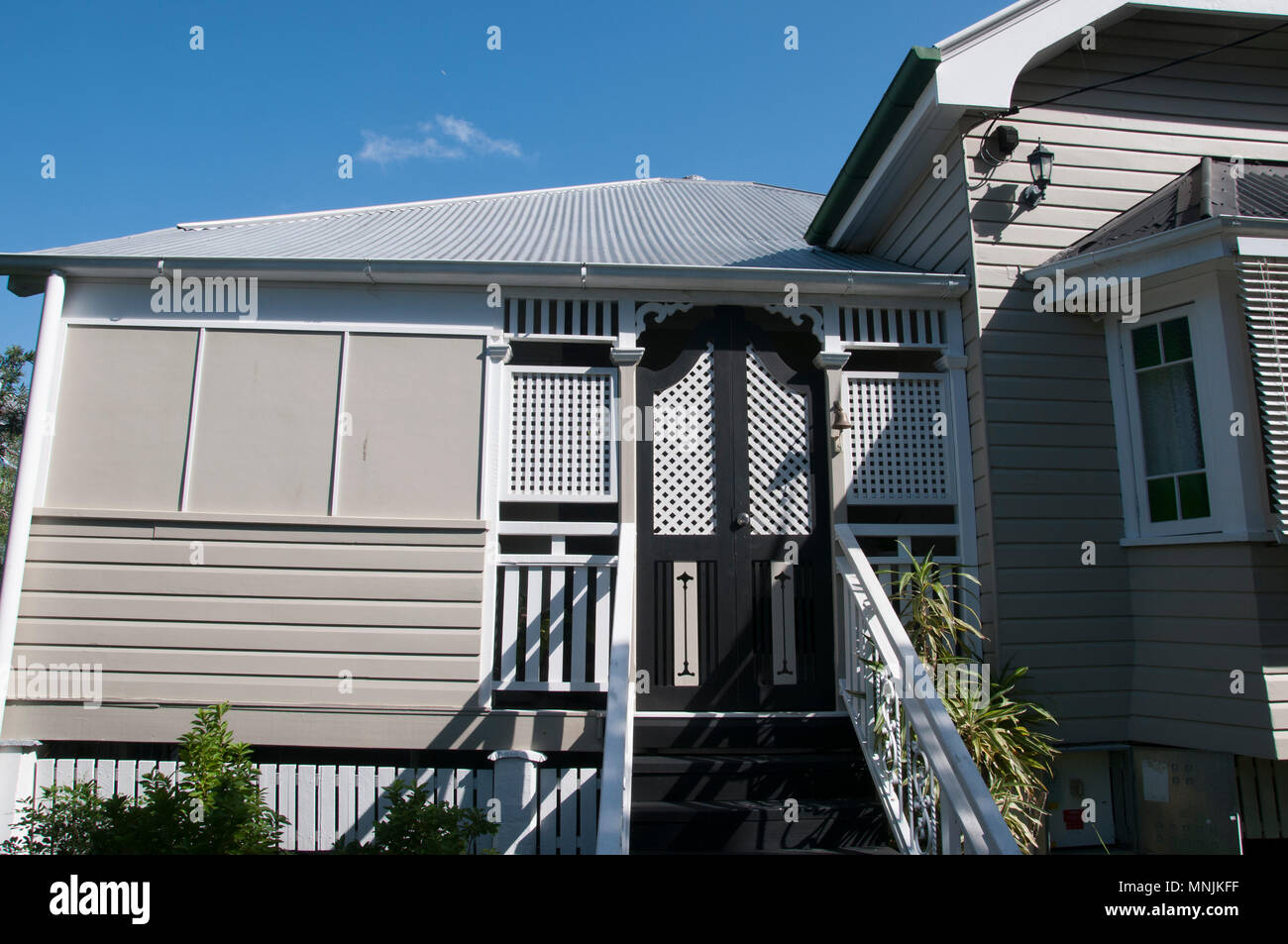 Queenslander-style timber home ca. 1913, typically featuring Art Nouveau decorative motifs, Brisbane, Australia Stock Photo